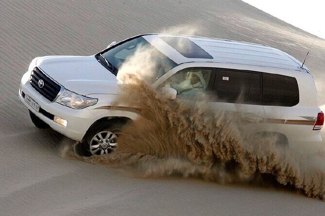 4hr Desert Safari: Sunset,Sunrise,Camel,Sand boarding,Inland Sea - Dune bashing: hold on, and respect the bumps