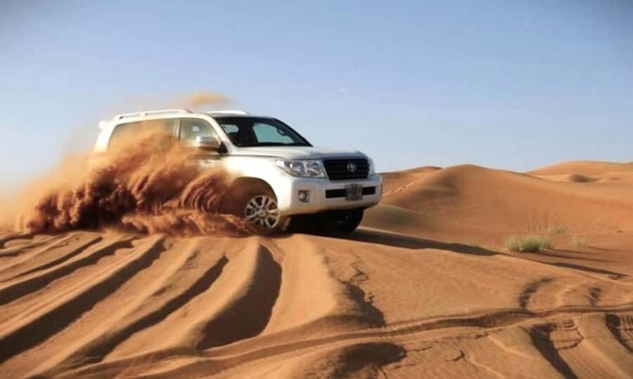 Doha: Desert Safari Dune Bashing, Sandboarding, & Camel Ride - Camel camp tea break: the cultural start before the sand starts moving