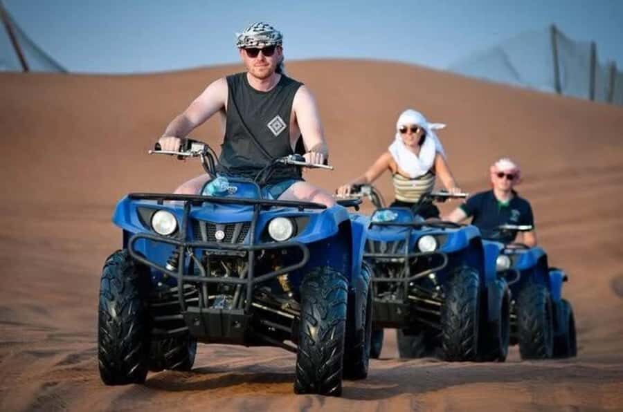 Doha: Desert Safari, Quad Biking, Sand Boarding & Camel Ride - Quad biking on the desert tracks: fun, but rules are real