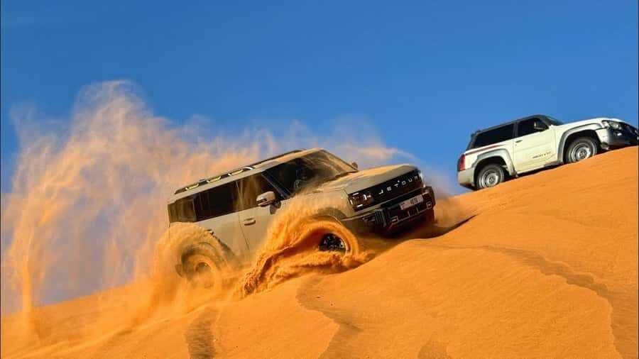 Doha: DesertSafari with Quad Bike, Camel Ride & Sandboarding - Sandboarding down golden dunes: the fun part that looks harder than it is