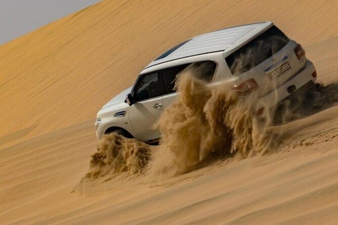 Doha Half Day Desert Safari Dune Bashing Camel Ride Sandboarding - Camel Place Stop: The Quick Culture Moment (10 Minutes of Riding)