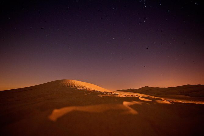Doha Night Desert Safari Camel Ride Dune Bashing with Transfer - Inland Sea / Khor Al Udaid: the stop that feels like a movie scene