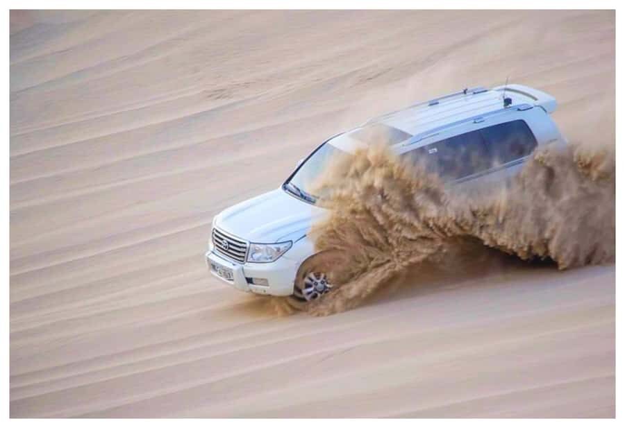 Dune Bashing, Sandboarding, Camel Ride & Optional ATV Ride - Camel camp and tea: the cultural reset before the rollercoaster