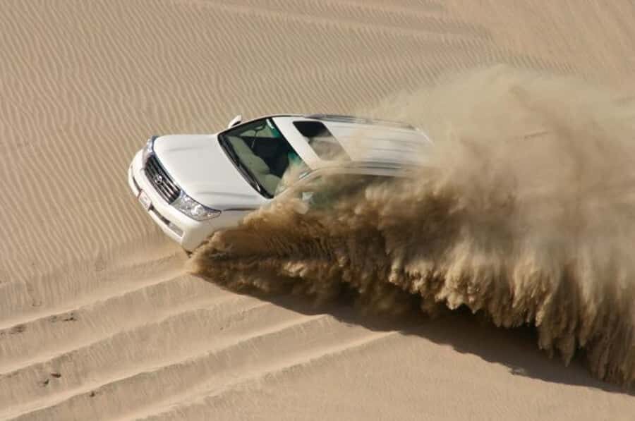 Dune Bashing, Sandboarding, Camel Ride & Optional ATV Ride - Dune bashing: where the driving skill turns fear into fun
