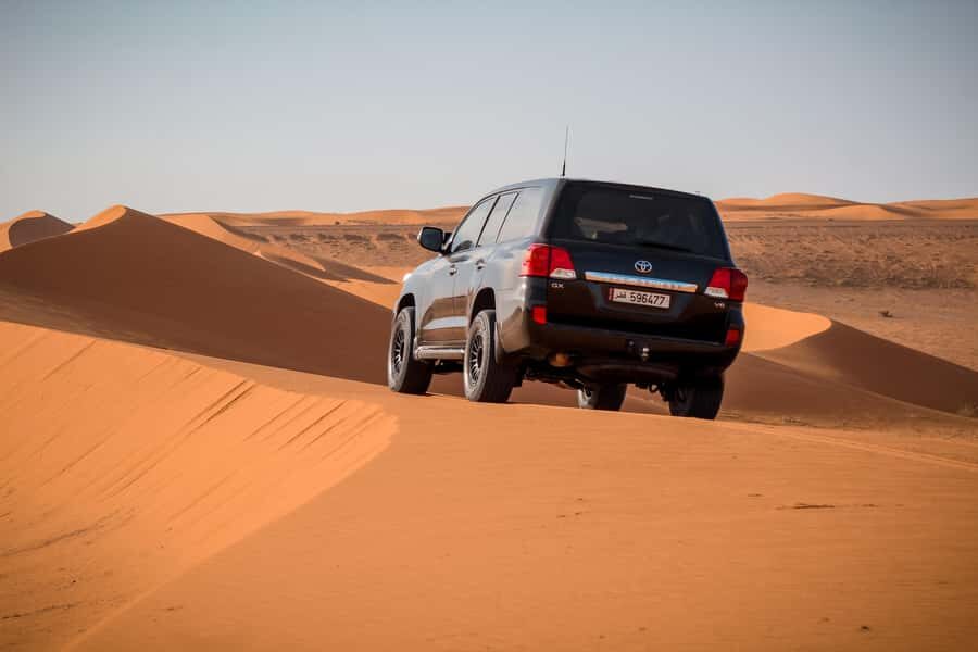 Qatar Desert Safari, Quad bike, Camel Ride and Sandboarding - Mesaieed Stop: Tea, Camel Ride, and a Short Bike Tour