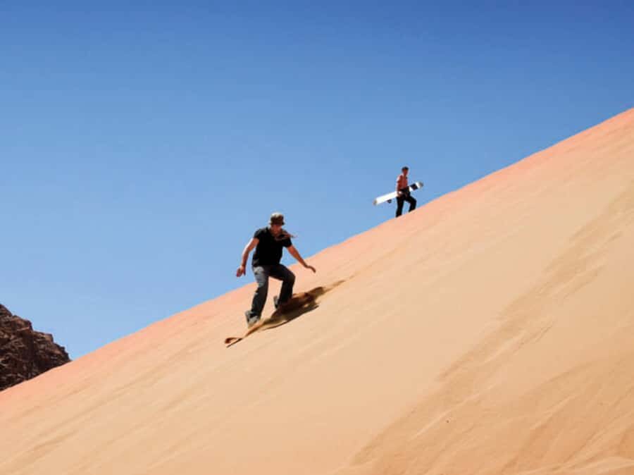Qatar Desert Safari, Quad bike, Camel Ride and Sandboarding - Sandboarding at Inland Sea: The Fun Part You’ll Remember